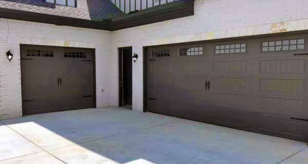 Single and Two-Car Garage Doors on a white brick home Flowery Branch, GA