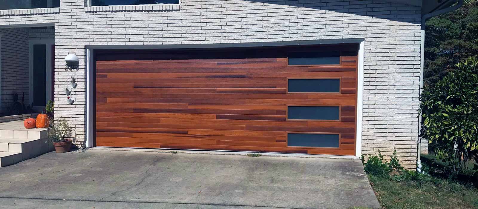 Modern garage door on white brick home Gainesville, GA